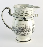 Lot 29 - A creamware puzzle jug, early 19th century,...