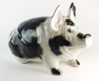 Lot 56 - A large black and white pig retailed by...