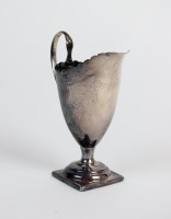 Lot 80 - A George III silver helmet cream jug, George...