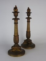 Lot 87 - A pair of Charles X ormolu candlesticks each...