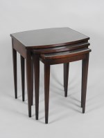 Lot 104 - A 20th century mahogany bowfront nest of three...