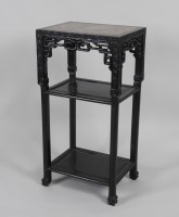 Lot 112 - A Chinese hardwood rectangular three tier...