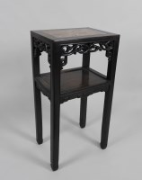 Lot 113 - A Chinese hardwood two tier rectangular...