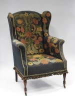 Lot 131 - A 19th century winged armchair with enclosed...