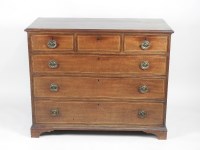 Lot 134 - A George III mahogany chest of three short...