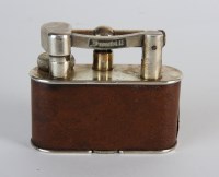 Lot 249 - A Dunhill plated table lighter with leather...