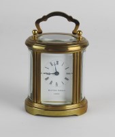 Lot 304 - A 20th century oval carriage timepiece, the...