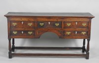 Lot 325 - a George III oak dresser base, mid Wales, the...