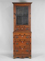 Lot 327 - A 19th century oak slender cabinet on chest,...