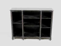 Lot 328 - An early Victorian ebonised low open bookcase...