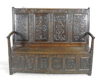 Lot 331 - An 18th century and later oak box seat settle...