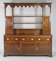 Lot 332 - A George III oak Shropshire style high dresser...