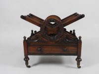 Lot 344 - A Victorian rosewood Canterbury, the three...