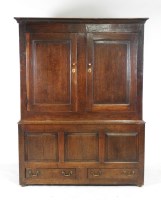 Lot 359 - A mid 18th century oak livery cupboard the...