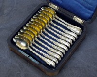 Lot 24 - A cased set of twelve German silver gilt...