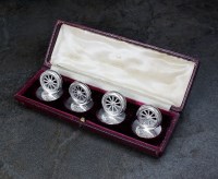 Lot 69 - A cased set of four silver place markers, John...