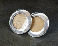Lot 81 - A pair of circular silver mounted frames, C.M.,...