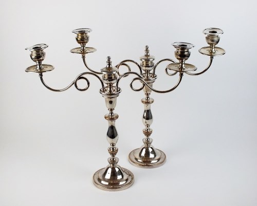 Lot 97 - A pair of Old Sheffield plate candelabra, each...