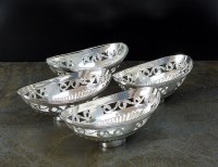 Lot 110 - A set of four silver navette shaped bon bon...