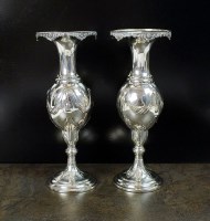 Lot 114 - A pair of Edwardian silver mounted vases,...