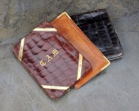 Lot 141 - An 18ct gold mounted snakeskin wallet, G H...