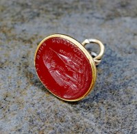 Lot 143 - A carnelian intaglio seal fob, depicting...