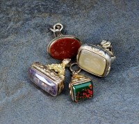 Lot 145 - A citrine seal fob, together with an amethyst...