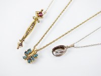 Lot 153 - A 14ct gold six stone blue topaz pendant,...