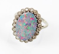 Lot 156 - An opal doublet and diamond cluster ring,...