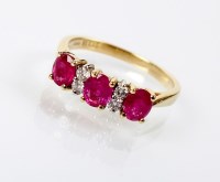Lot 162 - A seven stone ruby and diamond ring, designed...