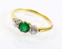 Lot 172 - A three stone emerald and diamond ring,...
