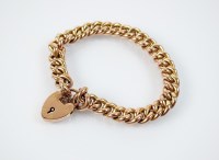 Lot 173 - A yellow metal hollow curb link bracelet, with...