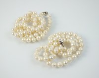 Lot 182 - Two strings of uniform cultured pearls, each...