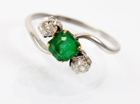 Lot 184 - A three stone emerald and diamond ring,...