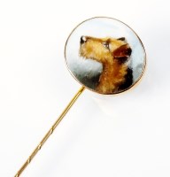 Lot 192 - An enamelled stick pin, the oval enamel...