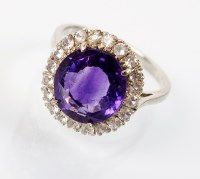 Lot 193 - An amethyst and white sapphire cluster ring,...