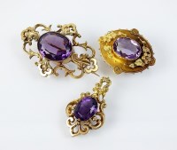 Lot 205 - A late 19th century amethyst set scroll work...