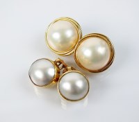 Lot 207 - A pair of Mabe pearl clip earrings, the yellow...