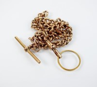 Lot 210 - A 9ct rose gold curb link Albert, with...