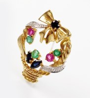 Lot 211 - An emerald, ruby, sapphire and diamond set...