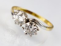 Lot 213 - A two stone diamond crossover ring, the two...