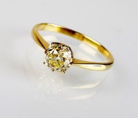 Lot 222 - A single stone fancy yellow diamond ring, the...