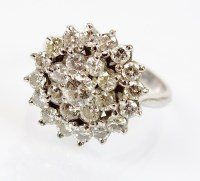 Lot 237 - A diamond circular cluster ring, designed as a...