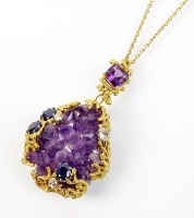 Lot 238 - An 18ct gold rough amethyst crystal, sapphire...