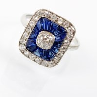 Lot 242 - An Art Deco style diamond and sapphire oblong...