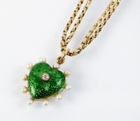 Lot 250 - An early 20th century green enamel, seed pearl...