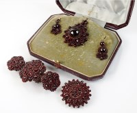 Lot 252 - A Bohemian garnet circular pendant...