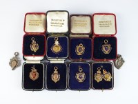 Lot 374 - A collection of nine 9ct gold and polychrome...