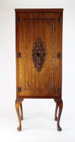 Lot 395 - A thirty-five drawer coin cabinet, raised on...