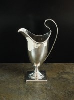 Lot 14 - A George III silver helmet cream jug, London...